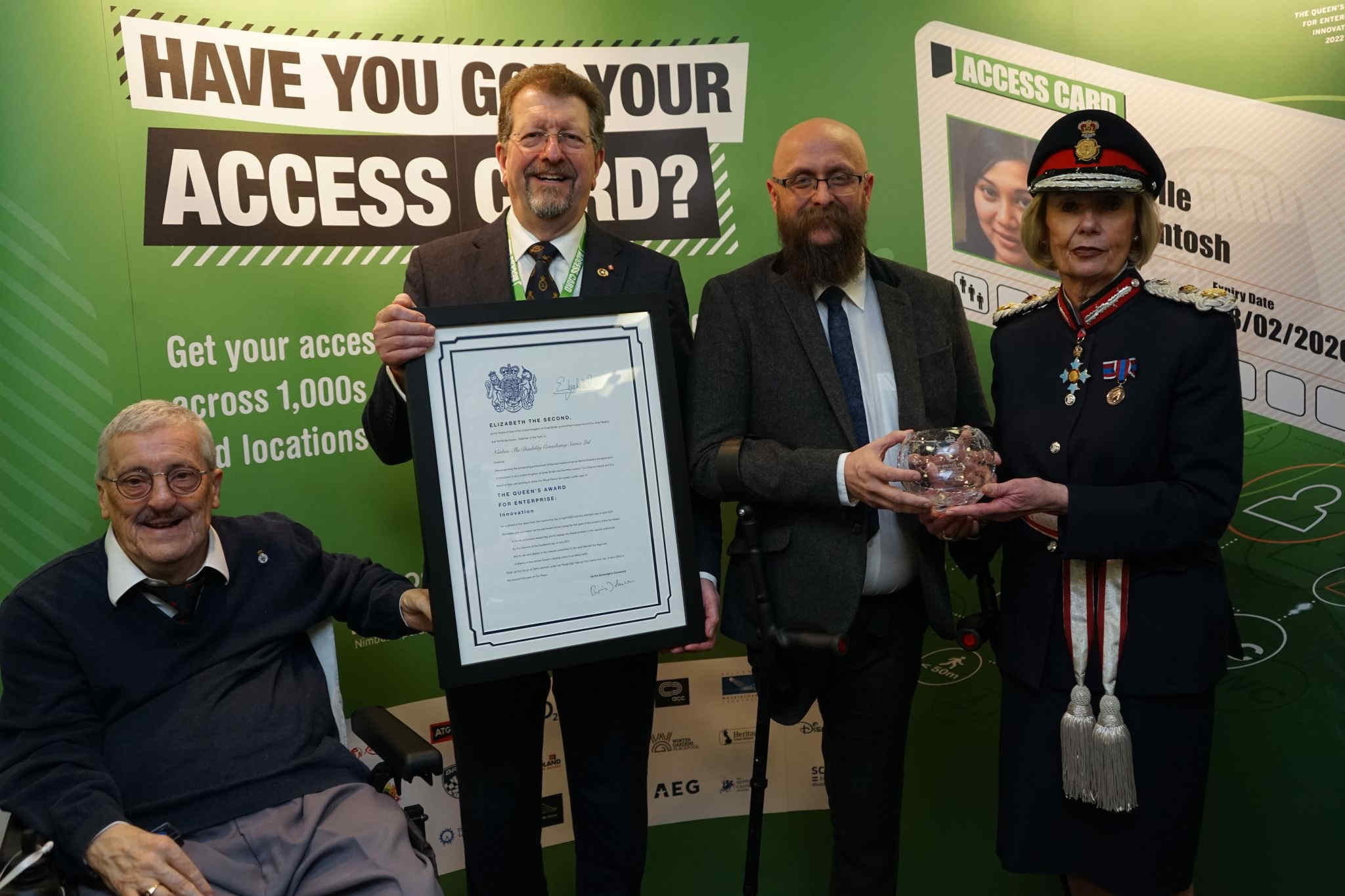 Team photo of Nimbus Disability receiving The Queen's Awards for Enterprise: Innovation in 2022. From left to right: Nimbus Disability chairman Steve Rigby, deputy Lord Lieutenant Tony Walker, owner of Nimbus Disability Martin Austin, and Lord Lieutenant Elizabeth Fothergill.